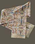 Long soft Tencel satin scarf by Ottimare with flower print for men and women in beige, yellow gold and yellow and light blue. Handmade in the Netherlands with a blind hem. This item is suitable for all seasons.