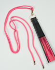 Pink lanyard attached to a silk fan out of the Ottimare collection.