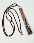 Brown lanyard attached to a silk fan out of the Ottimare collection.