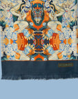 Ottimare scarf in ecological tencel satin with Tangka dansers in sienna and blue after painting of artist Marloes Otten. Handmade in the Netherlands. Detail of the fringe