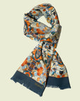 Ottimare scarf in ecological tencel satin with Tangka dansers in sienna and blue after painting of artist Marloes Otten. Handmade in the Netherlands