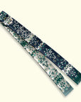 Ottimare Floral patterned frilly scarf with a fringe on a white background in Teal and dark blue. Handmade in the Netherlands