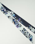 Very elegant long scarf designed and handmade by Ottimare. One side is navy blue, the other soft blue. The Thangka dancers on the scarf have various accent colors, like purple and cobalt.
