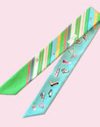 Cool caribbean twilly made of Tencel twill by Ottimare with one-line drawings of shoes and stripes. All the colors of the rainbow: blue, green, yellow, purple, pink, ..