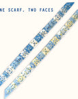 This Ottimare floral twilly ladies scarf with jasmines has two different sides in blue and yellow. One scarf, two faces! This ribbon tie is handmade in the Netherlands from sustainable twill art silk.