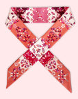 Handgemaakt Twilly dames sjaaltje van Ottimare in bordeaux, roze en oranje met jasmijn bloemen. De sjaal is van duurzame eco stof: twill kunst zijde met diagonale weving. Dutch design gemaakt in Nederland..