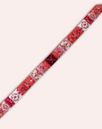 Twilly ladies ribbon scarf that has a tie model. Floral pattern with jasmins in orange, burgundy, pink and white. Handmade from twill fabric in The Netherlands. The scarf has two different sides.