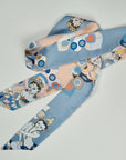 Beautiful scarf with four different dansers with different sides. One side in celestial blue the other in apricot. Designed and handmade by Ottimare.