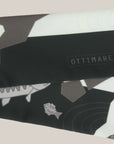 Detail with Ottimare logo om small ribbon scarf with fishing polar bears and fishes. Dutch design. Made in Holland.