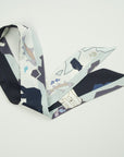 Small ribbon scarf with logo of Ottimare with fishing polar bears and fishes in blue and white with salmon accents. Dutch design. Made in Holland.
