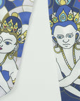 Detail of skinny scarf from Ottimare with a Thangka dancer in future middle blue with fresh green and yellow accents. Dutch design, made in the Netherlands