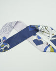 Skinny scarf from Ottimare with a Thangka dancer in future middle blue with fresh green and yellow accents. Dutch design, made in the Netherlands