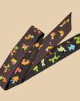 Tangram figures on a designer scarf from Ottimare.nl in chocloate, blue and green
