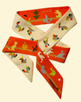 Tencel tangram sjaal van Ottimare met oranje en zandkleurige achtergrond en groene en grijze figuren. Handgemaakt in Nederland