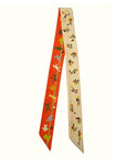 Handmade tencel twill scarf made by Ottimare in the Netherlands with Tangram puzzle figures. In orange and sand beige