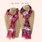 One Ottimare frilly scarves with two different colour patterns on mannequins against a beige background. Hand-made in the Netherlands