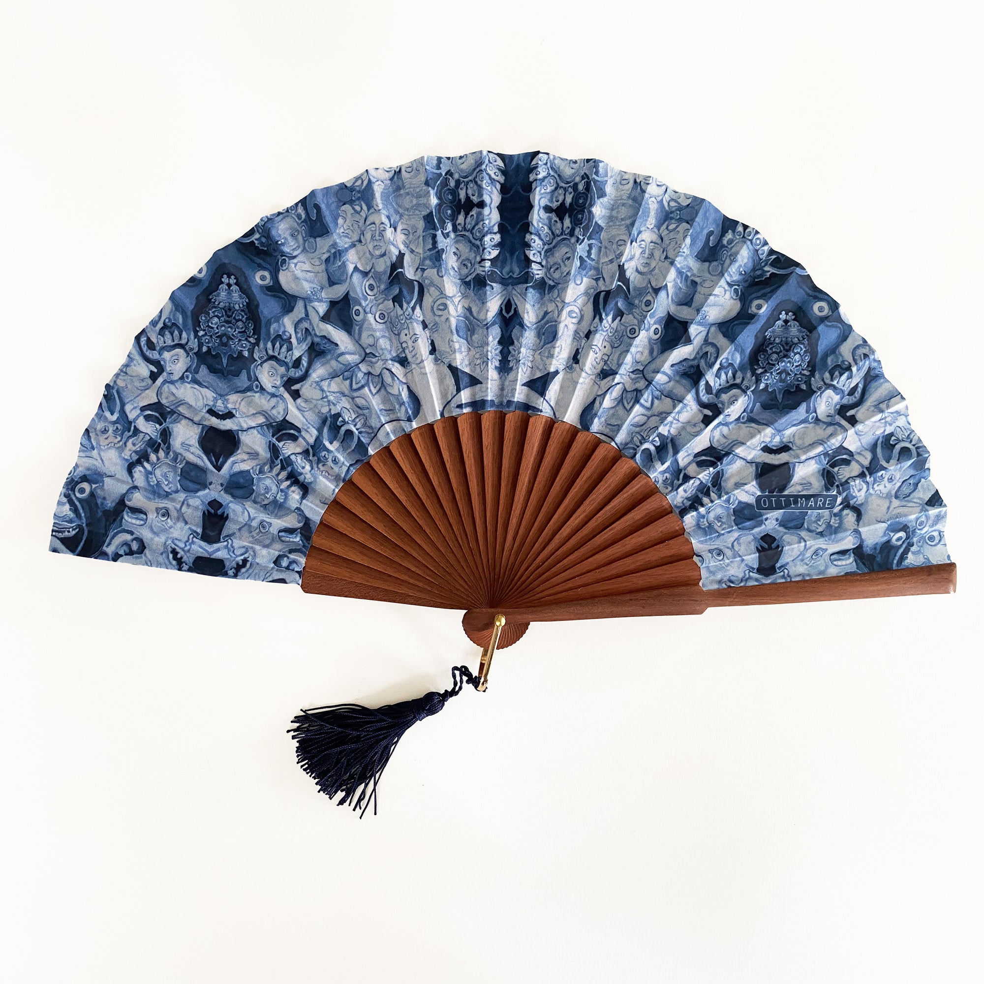 Ottimare handfan on a Spanish artisan wooden frame. The fabric shows thangka dansers in cyanotype color.