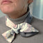 Model wearing the pink dolfin grey taupe grey Thangka scarf - Ottimare